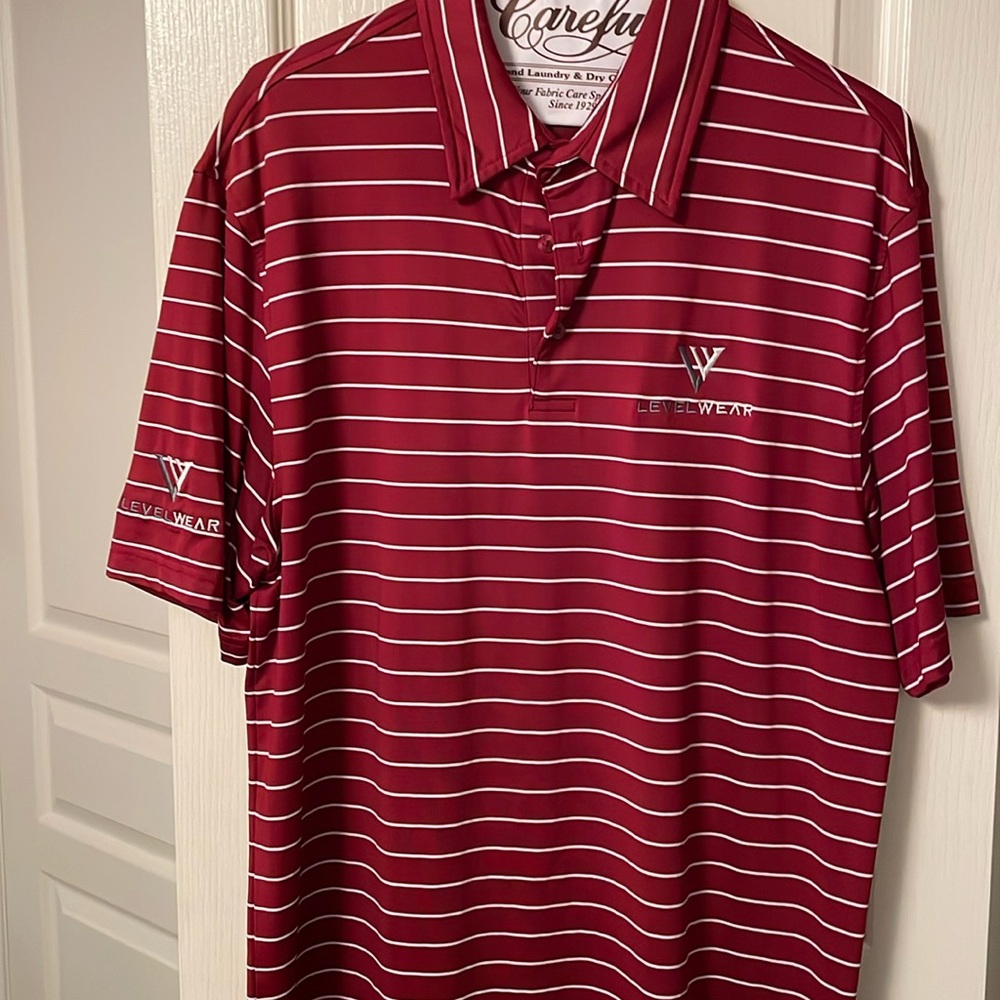Levelwear men’s golf polo. Red with a thin white stripe. Size medium